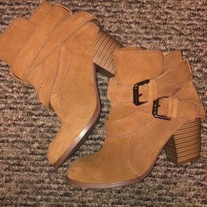 Soft fake fuzzy leather tan heeled boots.